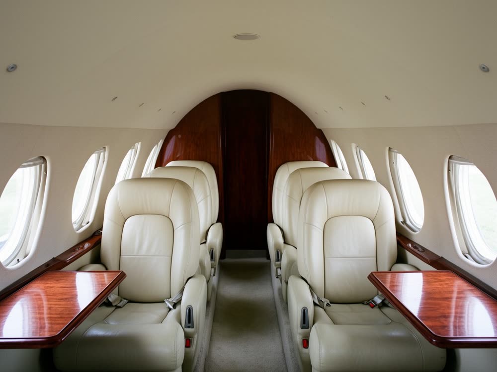 Private charter jet cabin, club seating